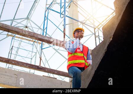 Engineer or inspector checking progressing work in construction site Stock Photo