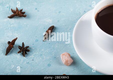 A cup of tea with anise flowers on blue table Stock Photo