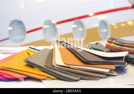 Natural leather upholstery samples with stitching in various colors Stock Photo