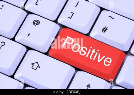 A keyboard with the word Positive in white lettering on a red enter key. Test for Coronavirus Covid-19 testing concept. England, UK, Britain Stock Photo