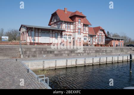 26 March 2020, Mecklenburg-Western Pomerania, Loitz: The former station building is located at the port of Loitz in the district of Vorpommern-Greifswald. After the building was not used for many years, former inhabitants of Loitz decided to give the old station a new shine. Over several years they lovingly restored the entire building and thus saved it from decay. Today the house 'Korl Loitz' houses the restaurant of the same name. Loitz is a town that has lost almost half of its inhabitants since reunification. After the end of the war, several thousand German refugees also found a new home Stock Photo