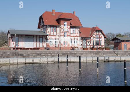 26 March 2020, Mecklenburg-Western Pomerania, Loitz: The former station building is located at the port of Loitz in the district of Vorpommern-Greifswald. After the building was not used for many years, former inhabitants of Loitz decided to give the old station a new shine. Over several years they lovingly restored the entire building and thus saved it from decay. Today the house 'Korl Loitz' houses the restaurant of the same name. Loitz is a town that has lost almost half of its inhabitants since reunification. After the end of the war, several thousand German refugees also found a new home Stock Photo