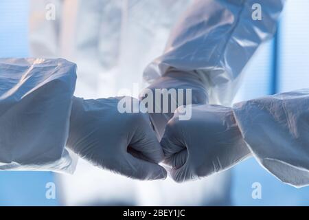 The doctor wearing surgical gloves encourage each other Stock Photo