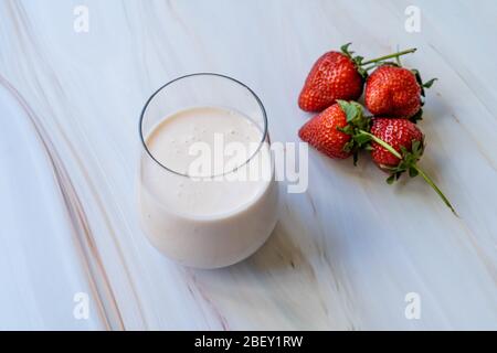 Kefir. Healthy Organic Drinkable Yogurt with Strawberries Fruit in Glass / Buttermilk Ayran. Readyt to Drink. Stock Photo