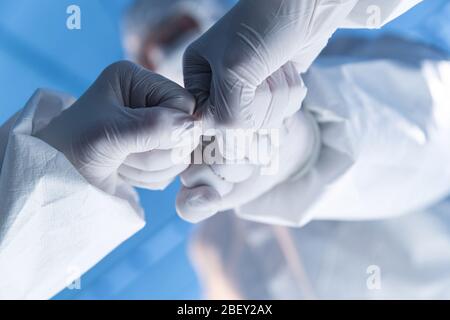 The doctor wearing surgical gloves encourage each other Stock Photo