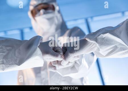 The doctor wearing surgical gloves encourage each other Stock Photo
