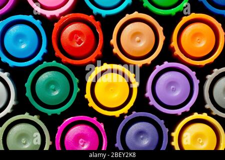 Close up still life pattern of the colourful caps on a set of colouring pens. Stock Photo