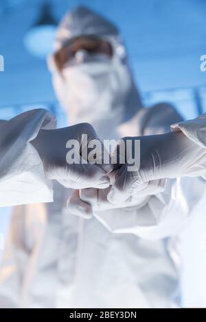 The doctor wearing surgical gloves encourage each other Stock Photo