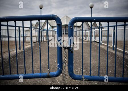 NOTE: IMAGE 29 OF A SET OF 35 IMAGES FEATURING LOCKED GATES OF BUSINESSES AND PLACES THAT ARE CLOSED DURING UK LOCKDOWN A padlock and chain is used to prevent access to an aquarium in Weston-super-Mare as the UK continues in lockdown to help curb the spread of the coronavirus. Stock Photo