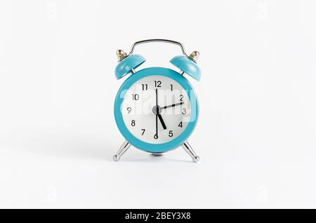 Blue alarm clock on white background. Time and deadline concept Stock Photo