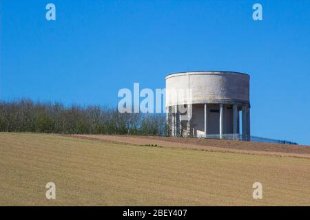 A Concrete Water Supply Tower on top of a small hill at Portavoe near Orlock, Groomsport in County Down Northern Ireland Stock Photo