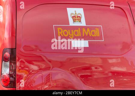 Bristol-April 2020-England- a close up view of the bright red royal mail van taking all its deliverys to there final destination Stock Photo