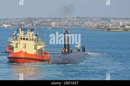 SAN DIEGO (Nov. 2, 2012) The Los Angeles-class attack submarine USS Topeka (SSN 754) departs Naval Base Point Loma for Portsmouth, N.H. Topeka will undergo a scheduled three-year engineered overhaul at Portsmouth Naval Shipyard. Topeka was commissioned Oct. 21, 1989 and has been homeported in San Diego for the past 10-years. Stock Photo