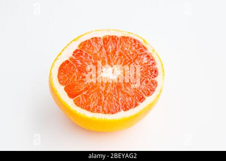 Fresh red cutted half of grapefruit isolated on white background Stock Photo