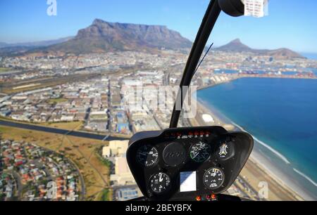 Photo from inside helicopter cockpit looking towards Cape Town CBD and Table Mountain Stock Photo