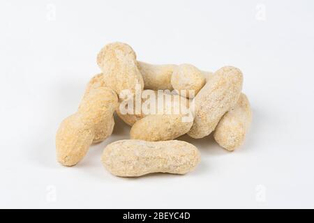 Shelled salted peanuts in shell on white background Stock Photo