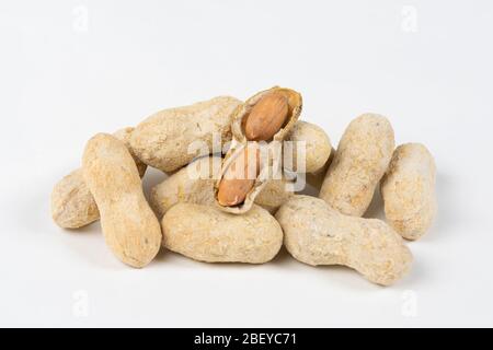 Shelled salted peanuts in shell on white background Stock Photo