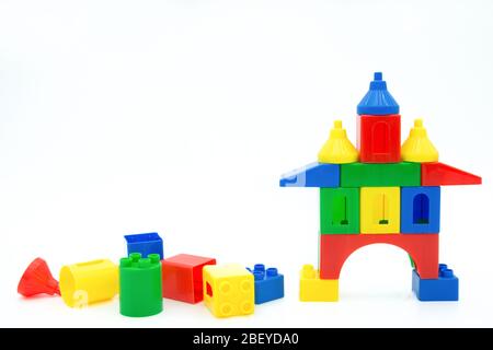 Colorful plastic building blocks isolated on the white background. Stock Photo