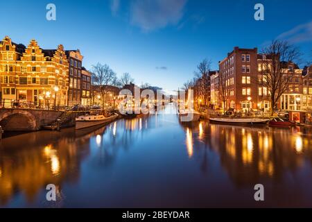 Amsterdam, Netherlands bridges and canals at twilight. Stock Photo
