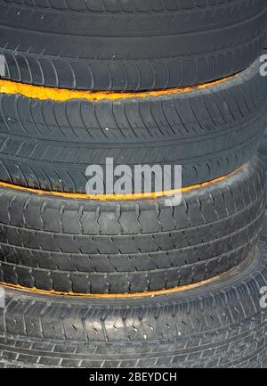 Pile of old car tires glued together Stock Photo