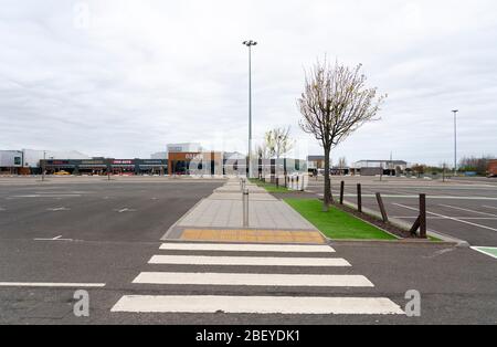 Edinburgh, Scotland, UK. 16 April 2020. Coronavirus lockdown continues in 4th week. Normally busy Ford Kinnaird retail shopping park Is virtually deserted. Iain Masterton/Alamy Live News Stock Photo