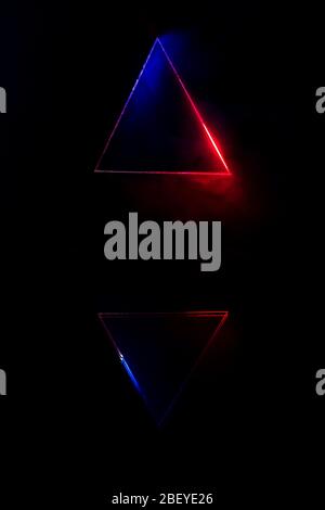 Lighting and smoke through the triangle and reflective. Stock Photo