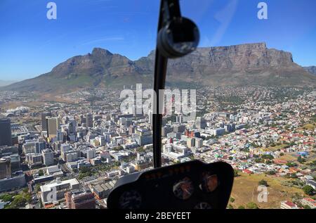 Photo from inside helicopter cockpit looking towards Cape Town CBD and Table Mountain Stock Photo