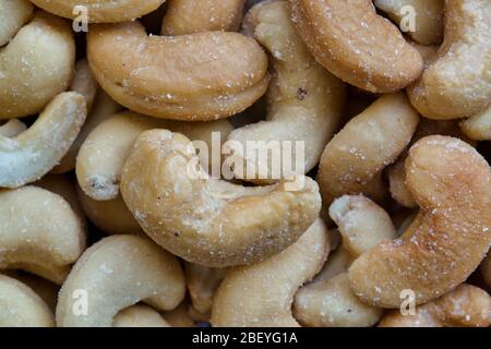 Cashew nuts, roasted and lightly salted. Macro image, full frame. Native to Brazil they are common as a snack and used as cooking ingredients. Stock Photo
