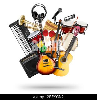 stack pile collage of various musical instruments. Electric guitar violin piano keyboard bongo drums tamburin harmonica trumpet. Brass percussion stud Stock Photo