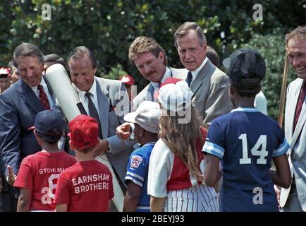 Flowers, notes of remembrance and jerseys are left at the base of a statue  of Philadelphia baseball player Mike Schmidt that has been tuned into a  memorial for longtime Philadelphia Phillies announcer