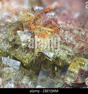 Crystals of fluorite with hematite inclusions from Illo calcite quarry in Finland Stock Photo