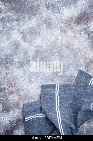 Linen napkin or towel on grey kitchen table Stock Photo