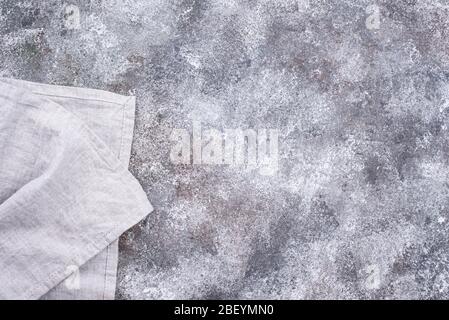 Linen napkin or towel on grey kitchen table Stock Photo