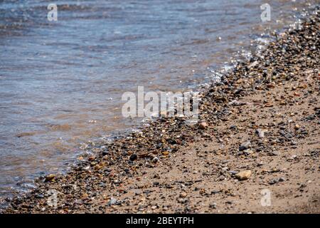 Soft Wave Of Blue Sea On Sandy Beach. Background - Summertime concept. Stock Photo