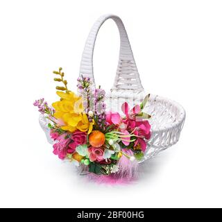 Easter basket from a flower arrangement on white background Stock Photo