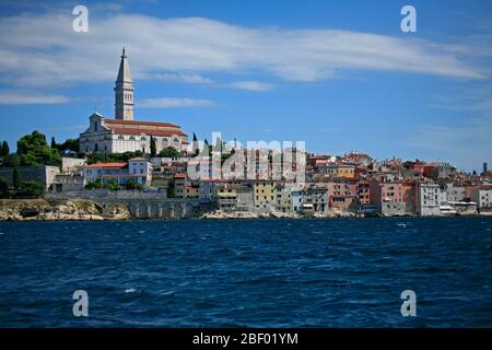 The bell tower of Saint Euphemia’s Basilica rises in the middle of the historic old town of Rovinj. Stock Photo