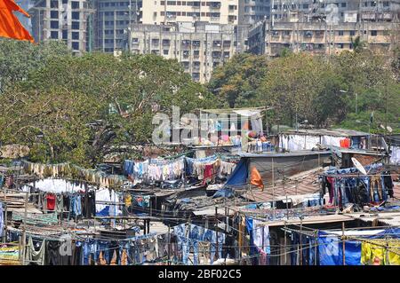 Mumbai, India-March 03,2013: Laundry Dhobi Ghat in Mumbai, people wash clothes on a city street. India's biggest wash. Stock Photo