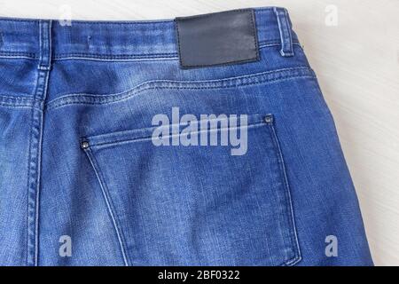 Denim trousers, fragment with a back pocket Stock Photo
