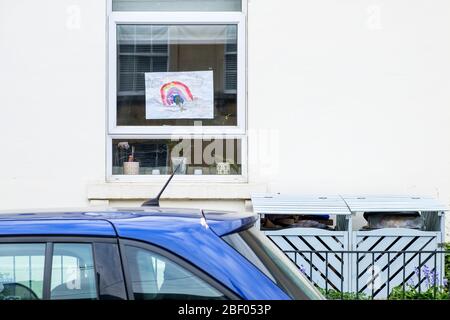 Chippenham, Wiltshire UK, 16th April, 2020. With the nation due to once again clap to show their support for the NHS tonight, a childs painting of a rainbow (a symbol of support for people wanting to show solidarity with NHS workers) is pictured in a front window of a home in Chippenham, Wiltshire. Credit: Lynchpics/Alamy Live News Stock Photo