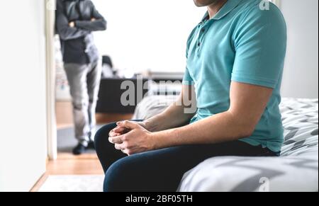 Gay couple in fight. Sad man in argument. Male friends or brothers in conflict. Stress or crisis in relationship. Infidelity and cheating or jealousy. Stock Photo