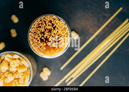 Various pasta  in a plastic jars for a long storage. Stock Photo