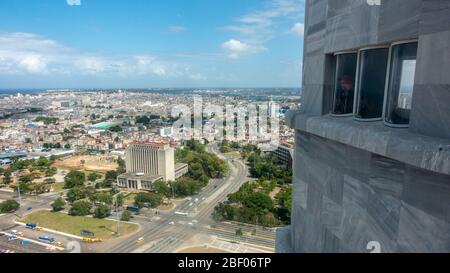 Aerial view from the top of The José Martí Memorial tower looking towards Havana old town, with person looking from the window, Plaza de la Revolución Stock Photo