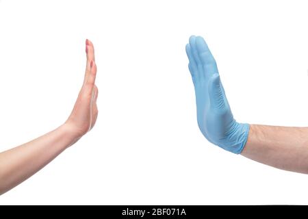 Hands in gloves stops hand without gloves Stock Photo