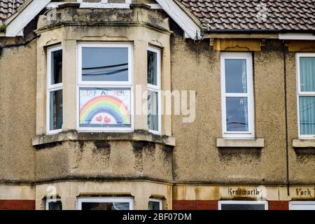 Chippenham, Wiltshire UK, 16th April, 2020. With the nation due to once again clap to show their support for the NHS tonight, a drawing of a rainbow (a symbol of support for people wanting to show solidarity with NHS workers)  is pictured in the front window of a home in Chippenham, Wiltshire. Credit: Lynchpics/Alamy Live News Stock Photo