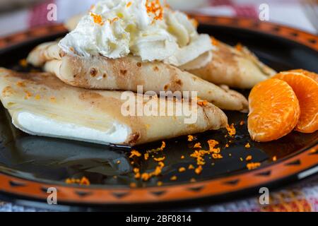 Pancakes with cheese and fruit. Flour products. Homemade pastries. Wheat flour. Pancake batter. Homemade cakes and cookies. Sweet pancakes. Stock Photo