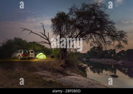 Zambezi National Park, Matabeleland North Province, Zimbabwe offers camping on the banks of the mighty Zambezi River. Stock Photo