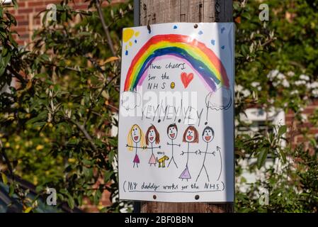 Children's rainbow artwork to show support for care workers and the NHS during the coronavirus (Covid-19) outbreak, April 2020. Stock Photo