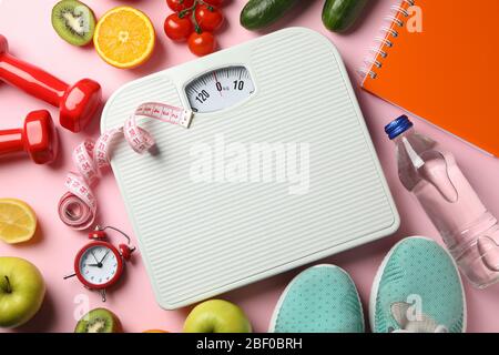 https://l450v.alamy.com/450v/2bf0brh/weight-loss-or-healthy-lifestyle-accessories-on-pink-background-2bf0brh.jpg