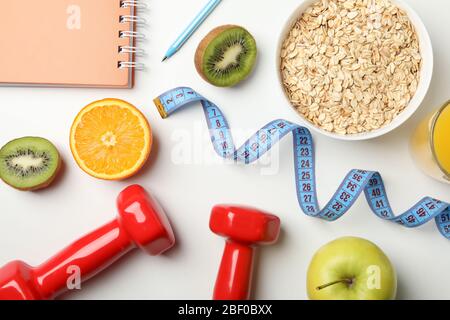 Weight loss accessories on white background, top view Stock Photo