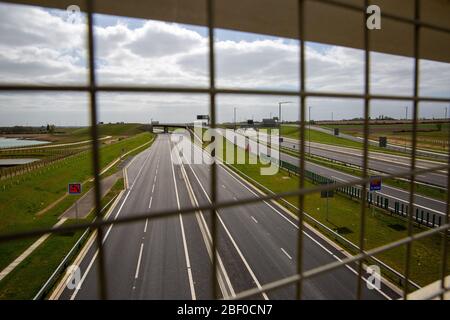 PIC BY GEOFF ROBINSON PHOTOGRAPHY 07976 880732.   Picture dated April 13 shows main A1 road at Huntingdon in Cambridgeshire on Bank Holiday Monday lunchtime as most people stay at home and leave the roads empty.   The roads across Britain were empty today on Easter Bank Holiday Monday (Mon) as lockdown continues to help stop the spread of coronavirus. There were 12 million leisure car journeys made over the Easter Bank Holiday weekend last year, but today the main A1 road at Huntingdon in Cambridgeshire was deserted.  The Easter holidays are traditionally a time to get-away but this year the g Stock Photo